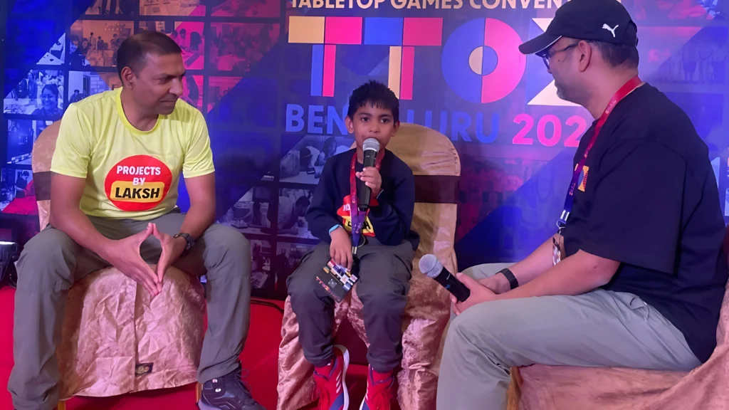  Lakshveer attending a game convention with his father.