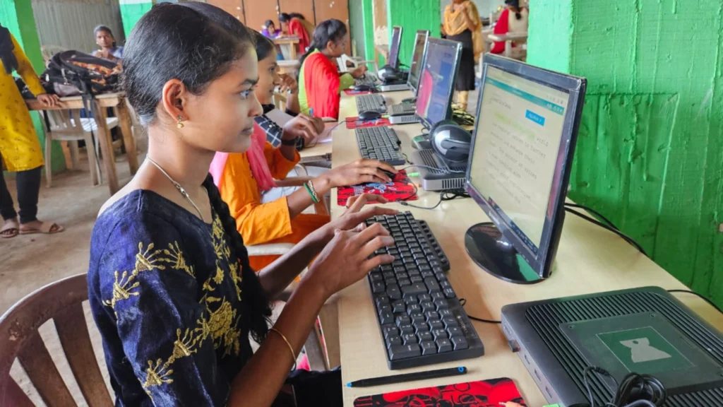 Children using technology to study in a microschool.
