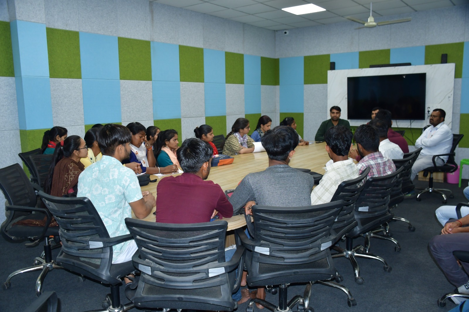 Students having a meeting on IT education with members of Yuva Jagriti Sansthan. 