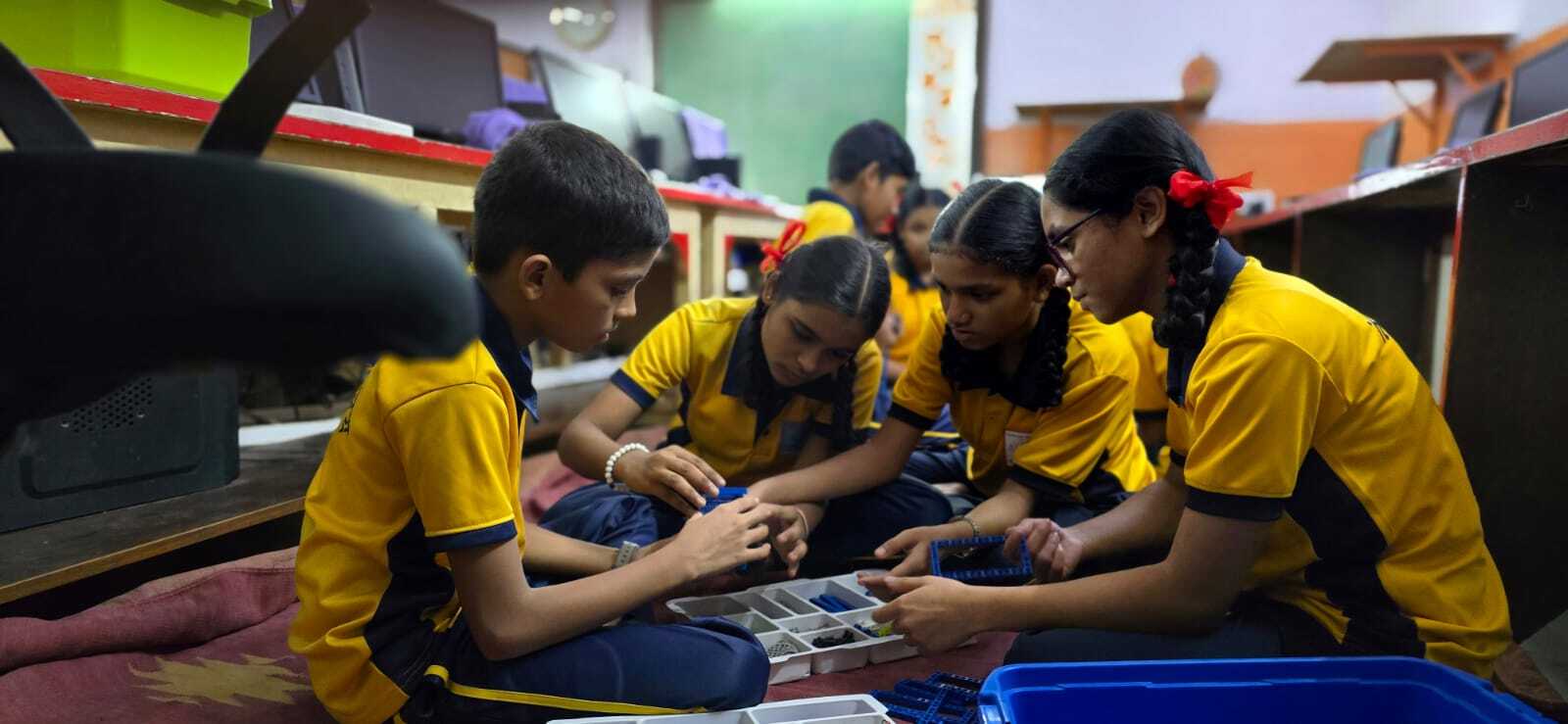 Kids enjoying engaging interactive learning activities in a learning pod.