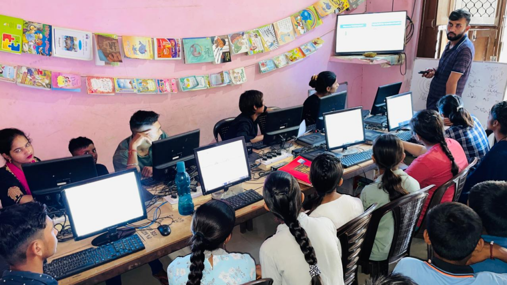 Kapil Jangra teaching students at Apni Pathshala learning pod in Purkhas Rathi.