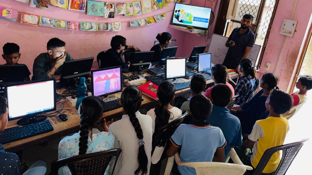 Kapil Jangra teaching students at Apni Pathshala learning pod in Purkhas Rathi.