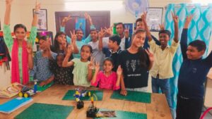 Kids at ApniPathshala learning pod learning robotics.