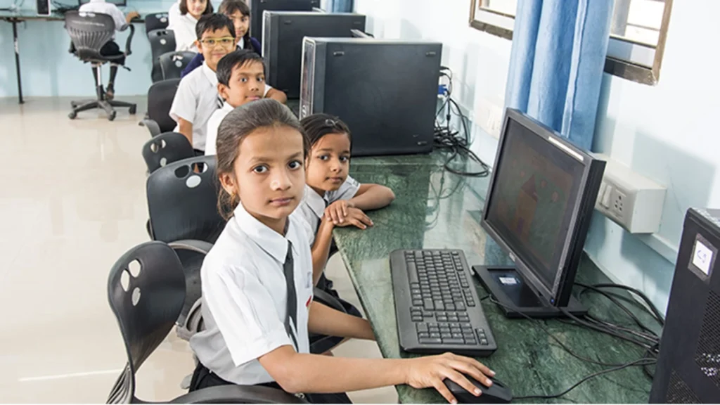 Children learning through personal computers instead of traditional methods in school.