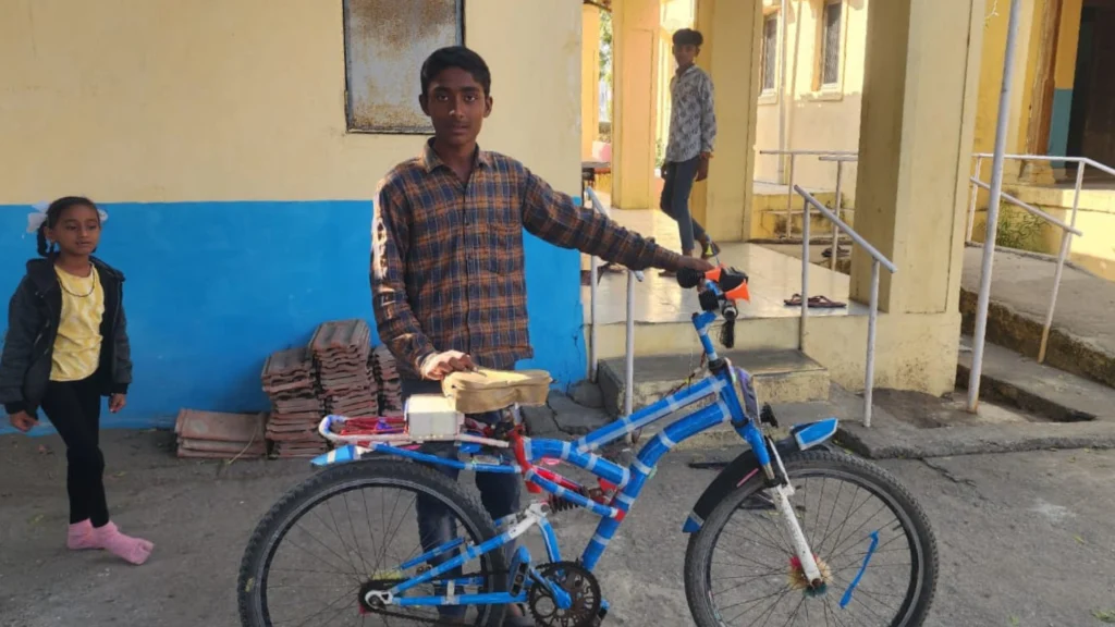 Rizwan with the electric bike he built himself